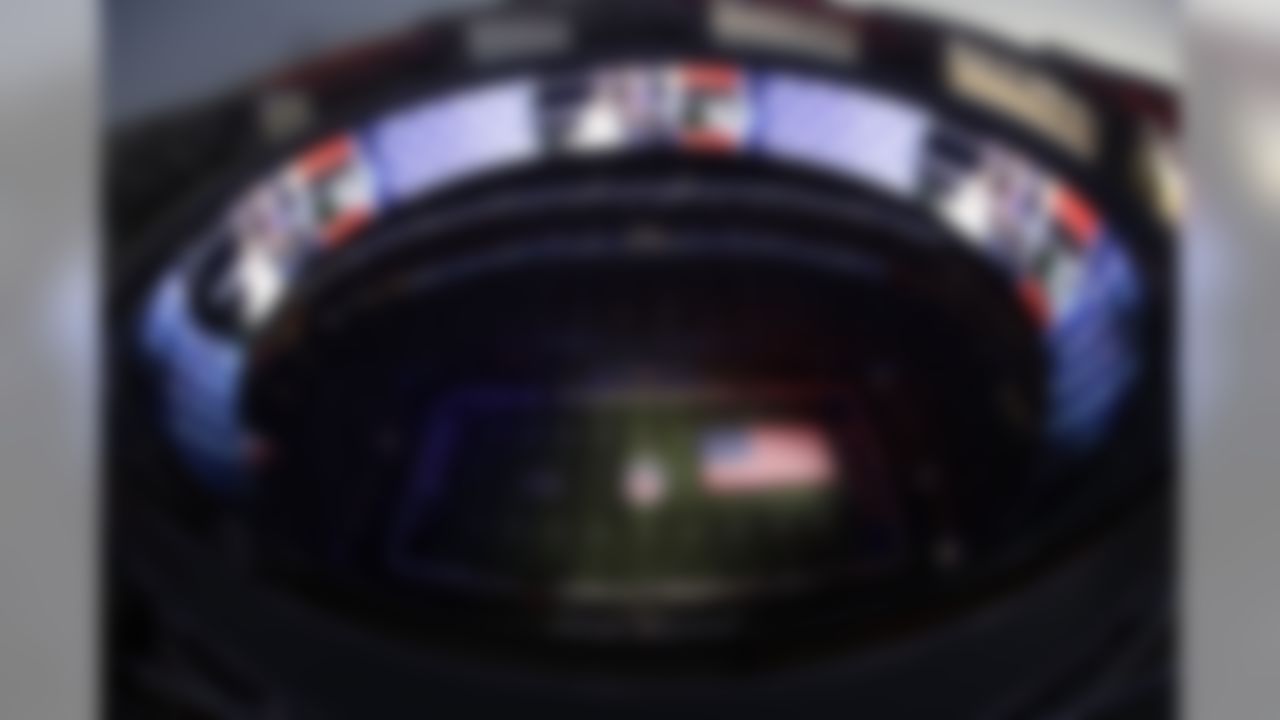 An American flag is displayed on the file as Gladys Knight sings the national anthem before the NFL Super Bowl 53 football game between the Los Angeles Rams and the New England Patriots Sunday, Feb. 3, 2019, in Atlanta. (AP Photo/Morry Gash)