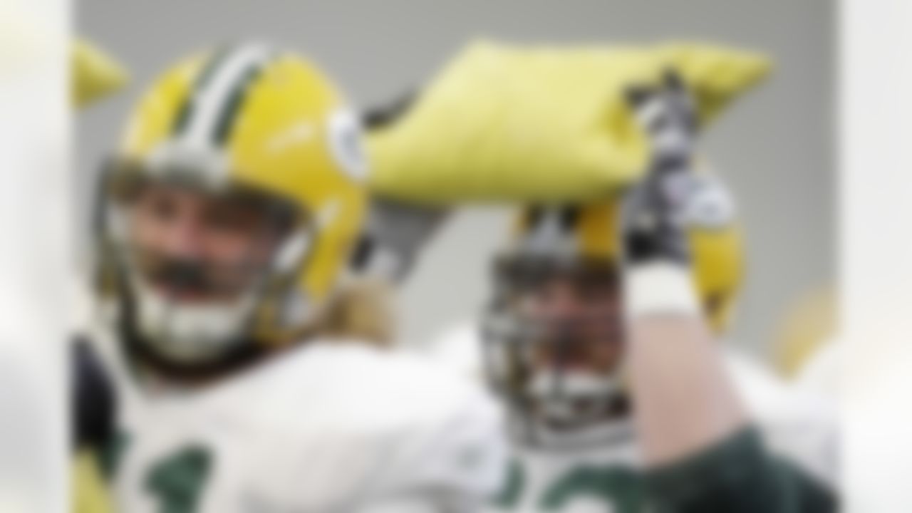 Green Bay Packers' Scott Wells, right, and Josh Sitton, left, use sand bags during drills in practice, Wednesday, Feb. 2, 2011 in Dallas. Green Bay will face the Pittsburgh Steelers in the NFL football Super Bowl XLV Sunday. (AP Photo/Eric Gay)