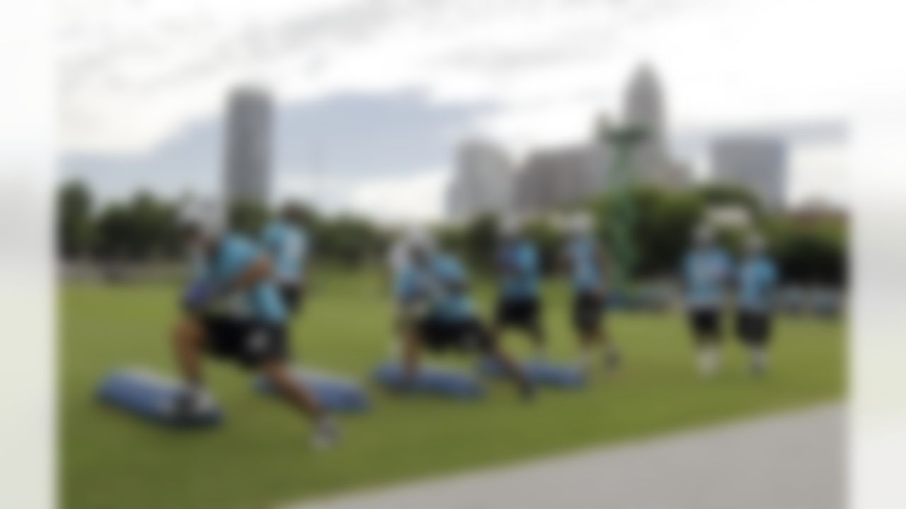 Carolina Panthers running backs run through a drill during a summer practice session for the NFL football team in Charlotte, N.C., Wednesday, June 16, 2010. (AP Photo/Chuck Burton)