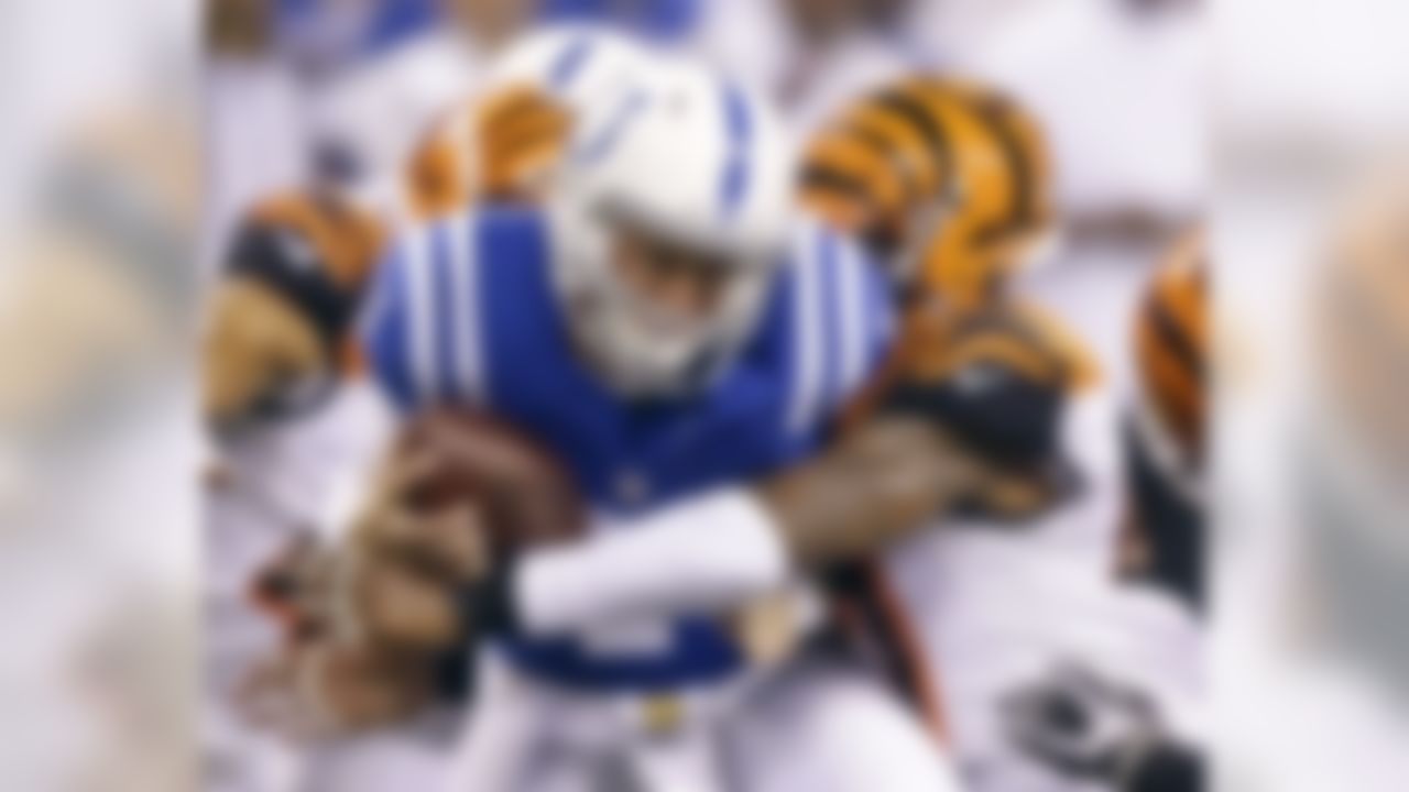 Indianapolis Colts' Bryan Bennett (7) is tackled Cincinnati Bengals' P.J. Dawson (47) during the first half of an NFL preseason football game Thursday, Sept. 3, 2015, in Indianapolis.