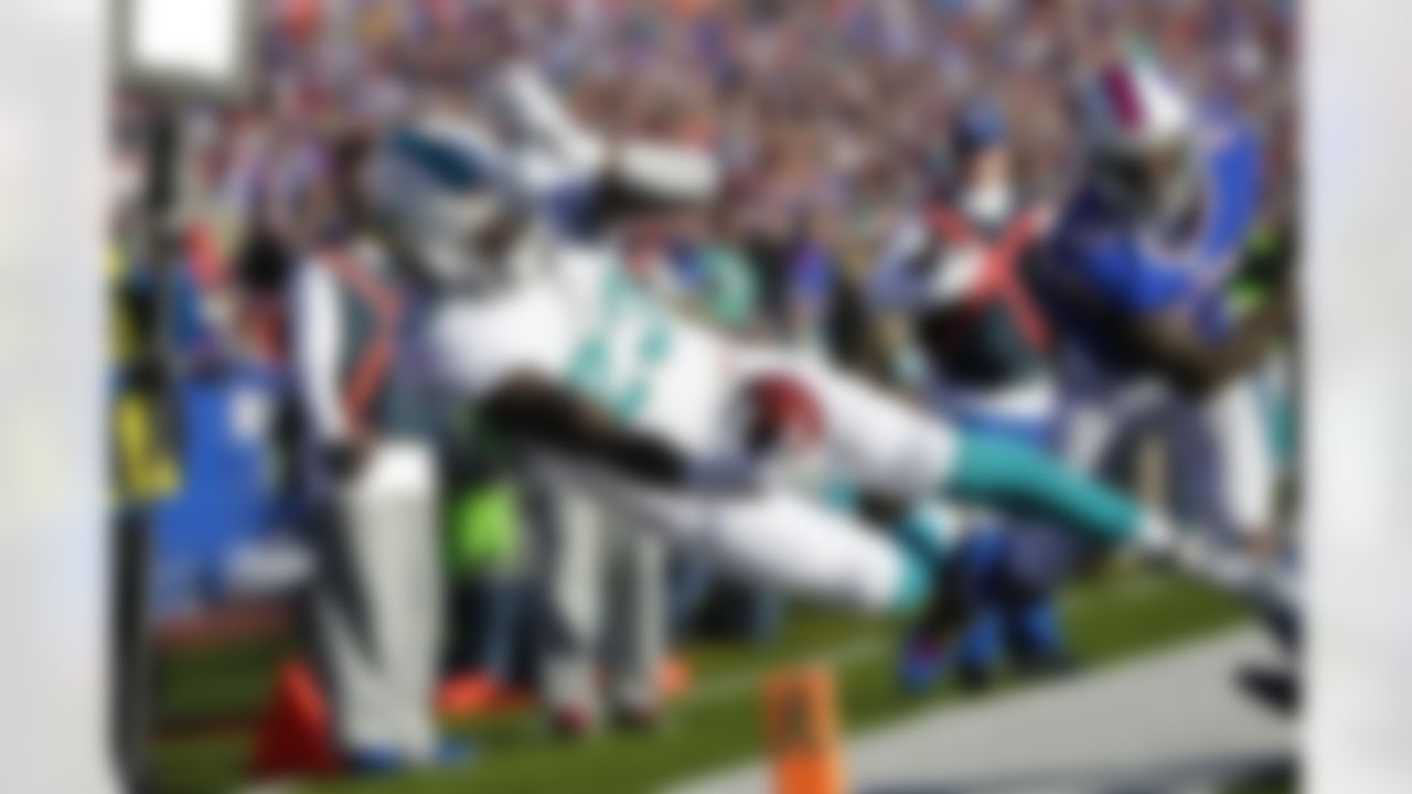 Miami Dolphins running back Jay Ajayi dives past the Buffalo Bills' Duke Williams at the goal line. (AP Photo/Bill Wippert)