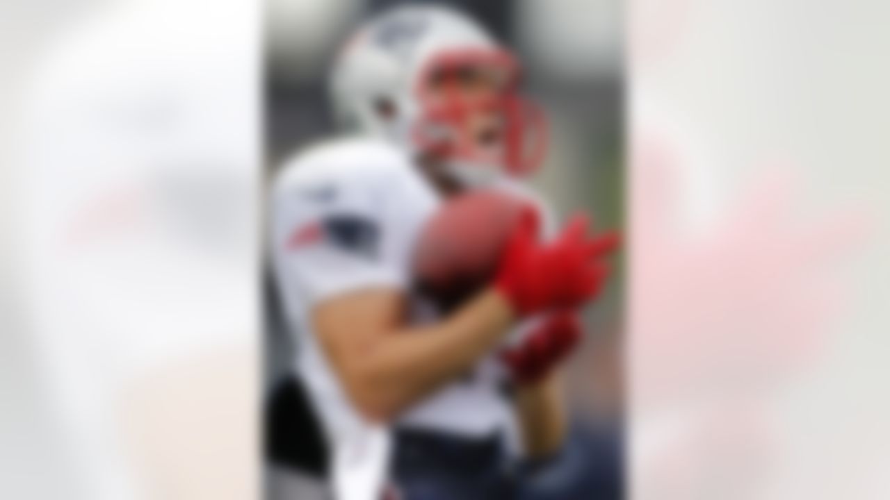 New England Patriots wide receiver Julian Edelman (11) makes a catch during an NFL football training camp in Foxborough, Mass., Sunday, July 29, 2012. (AP Photo/Steven Senne)