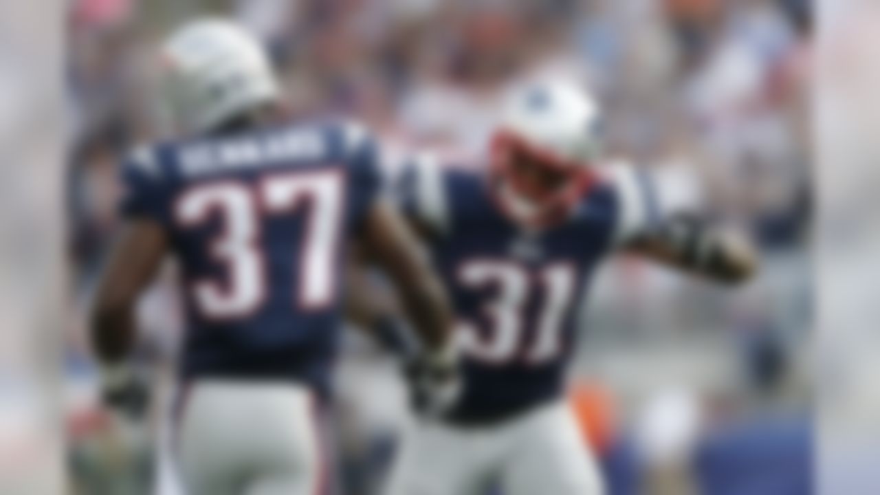 New England Patriots cornerbacks Alfonzo Dennard (37) and Aqib Talib (31) celebrate an incomplete pass by the Tampa Bay Buccaneers in the second half of an NFL football game Sunday, Sept. 22, 2013, in Foxborough, Mass. The Patriots won 23-3.(AP Photo/Elise Amendola)