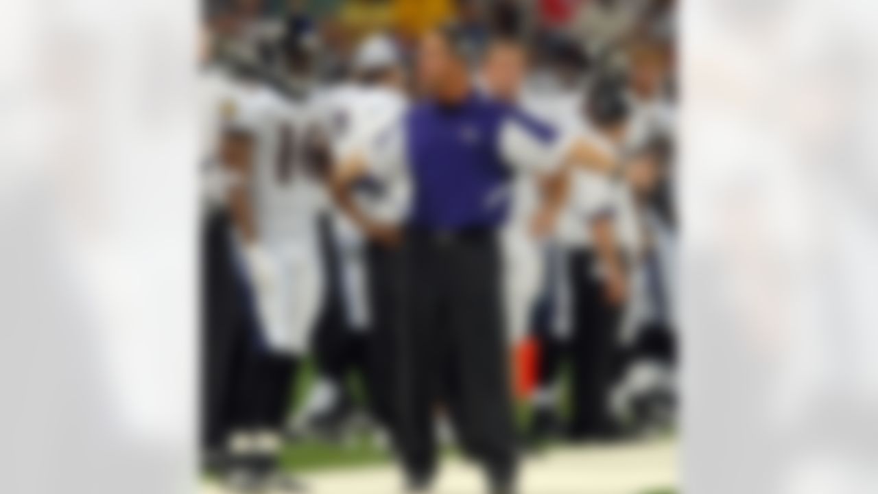 Baltimore Ravens head coach John Harbaugh talks with wide receiver Yamon Figurs during an NFL preseason football game against the St. Louis Rams on Saturday, Aug. 23, 2008, in St. Louis. The Rams beat the Ravens 24-10. (AP Photo/Kyle Ericson)