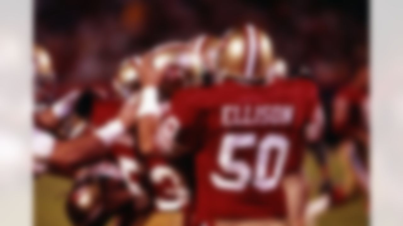 San Francisco 49ers linebacker Bill Romanowski (53) is congratulated by linebacker Riki Ellison (50) after intercepting a pass during a Super Bowl XXIII NFL game against the Cincinnati Bengals in Miami, on January 22, 1989. The 49ers defeated the Bengals 20-16. (AP Photo/Vernon Biever)
