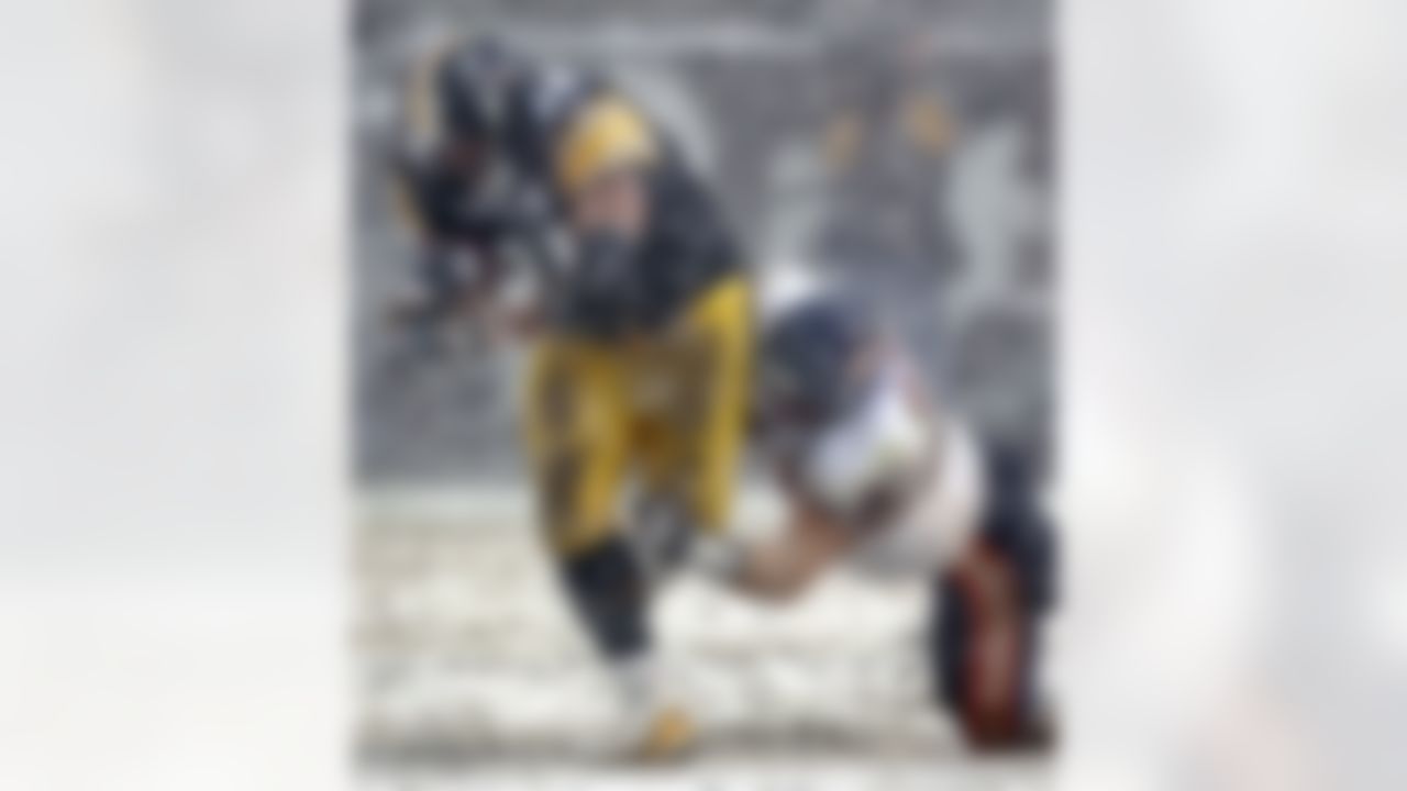 Pittsburgh Steelers' running back Jerome Bettis gets by Chicago Bears' linebacker Brian Urlacher for a first down in a snowstorm during the fourth quarter of the Steelers 21-9 win in Pittsburgh on Sunday, Dec. 11, 2005. (AP Photo/Keith Srakocic)