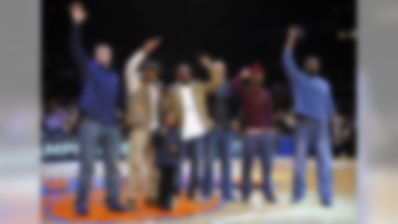 Members of the Super Bowl-champion New York Giants wave as they are introduced during a timeout in the NBA basketball game between the Utah Jazz and the New York Knicks on Monday, Feb. 6, 2012, in New York. From left are Bear Pascoe, Corey Webster, Hakeem Nicks, Mark Herzlich, Aaron Ross and Mathias Kiwanuka. (AP Photo/Kathy Kmonicek)