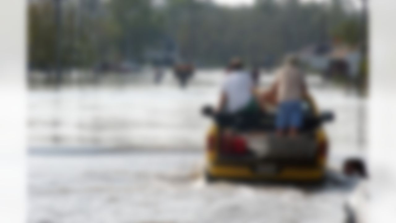 Residents of Slidell, La., try to get to their homes on Tuesday, Aug. 30, 2005, after Hurricane Katrina flooded the area. (AP Photo/Mari Darr-Welch)