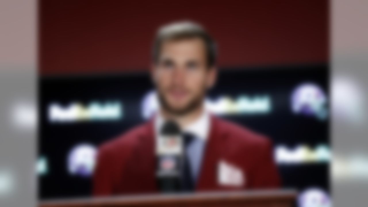 Washington Redskins quarterback Kirk Cousins dons a pocket square emblazoned with initials representing "Hail To The Redskins" as he speaks at a news conference after an NFL football game against the Philadelphia Eagles, Sunday, Oct. 16, 2016, in Landover, Md. (AP Photo/Alex Brandon)