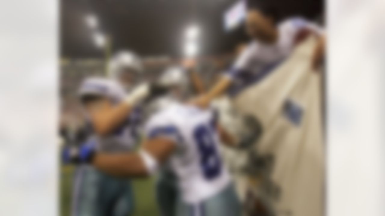 Dallas Cowboys wide receiver Terry Glenn (83) celebrates his fourth quarter touchdown against the Washington Redskins with a fan in the stands and teammates Marc Colombo (75) and Jason Witten (82) during a football game in Irving, Texas, Sunday, Sept. 17, 2006. (Matt Slocum/Associated Press)