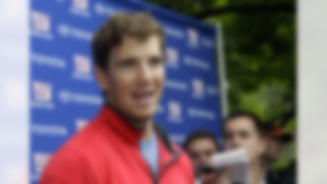 New York Giants quarterback Eli Manning speaks to reporters at NFL football training camp in Albany, N.Y., Sunday, July 29, 2012. (AP Photo/Kathy Willens)
