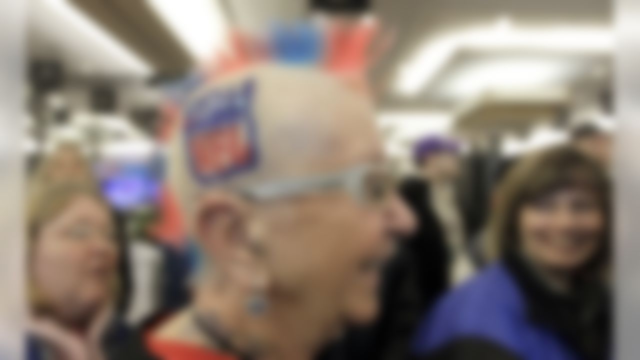 Mary Steinkraus, from Germantown, Wis., wears her NFL mohawk as she visits radio row at the Super Bowl XLVI media center Friday, Feb. 3, 2012, in Indianapolis. The New England Patriots will face the New York Giants in Super Bowl XLVI on Feb. 5. (AP Photo/David J. Phillip)