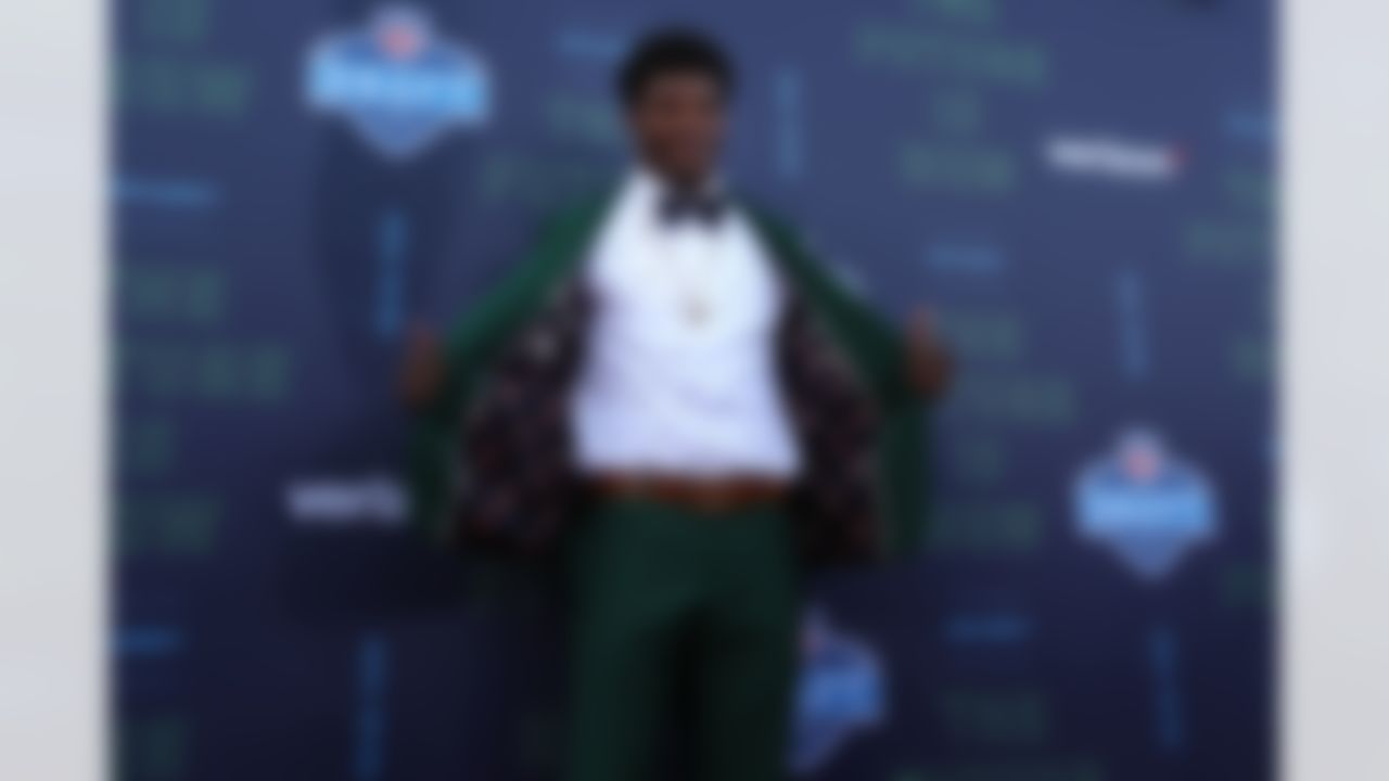 Louisville quarterback Lamar Jackson poses for photos.
