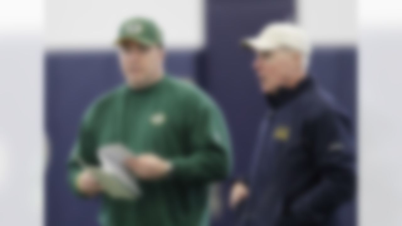 Green Bay Packers coach Mike McCarthy, left, and general manager Ted Thompson, right, talks during practice, Wednesday, Feb. 2, 2011, in Dallas. Green Bay will face the Pittsburgh Steelers in the NFL football Super Bowl XLV Sunday. (AP Photo/Eric Gay)