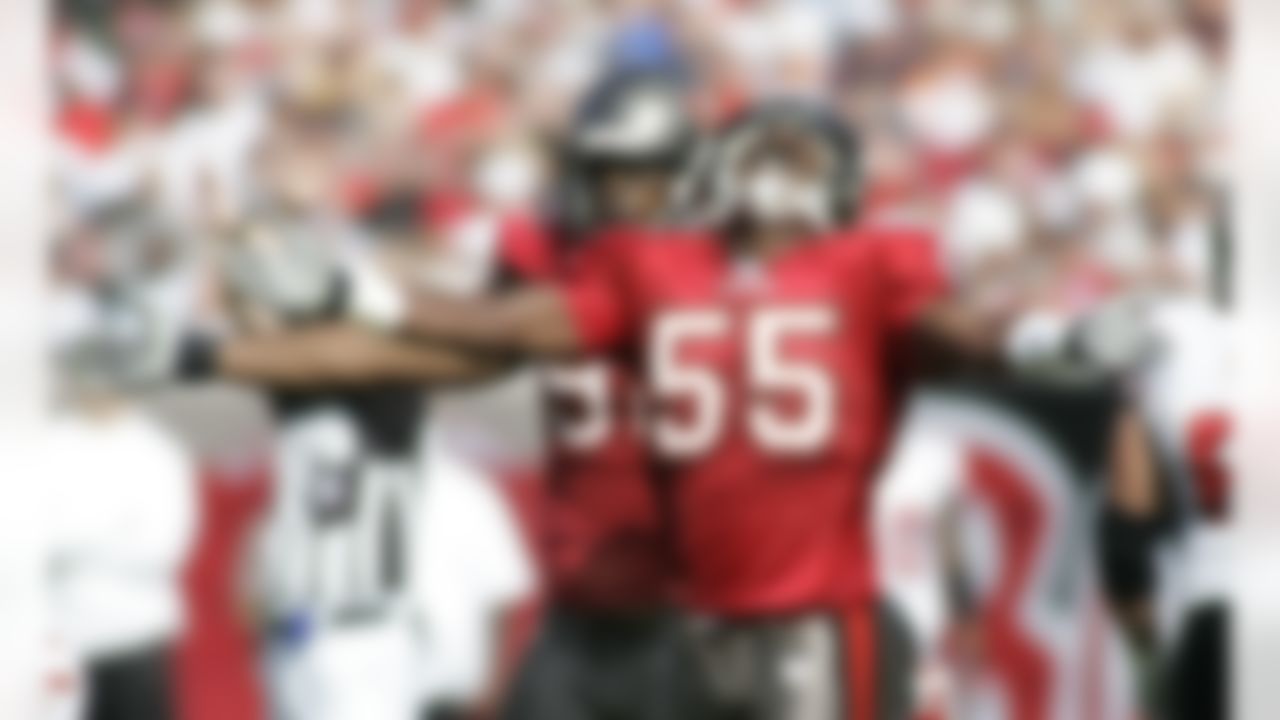 96 Ellis Wyms and 55 Derrick Brooks celebrate holding on third down as the Atlanta Falcons defeated the Tampa Bay Buccaneers 17-6 at Tampa's Raymond James Stadium on December 10, 2006. Photo by Getty Images.