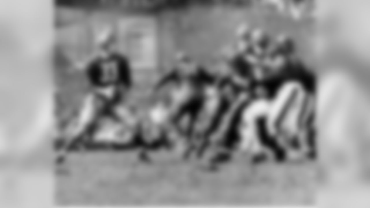 Washington Redskins quarterback Sammy Baugh drops back to pass against the Chicago Bears in Washington, D.C., on Sept. 13, 1942. (Associated Press)