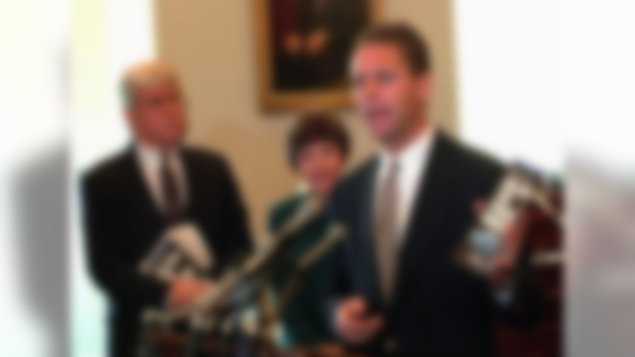 House Budget Committee member Rep. Steve Largent, R-Okla., holds a copy of Empower America's brochure "Your Turn to Balance the Federal Budget," during a preview on Capitol Hill, May 1, 1995. Empower America co-founder Jack Kemp and Rep. Sue Myrick, R-N.C. look on. Empower America is a public policy group. (AP Photo/Joe Marquette)