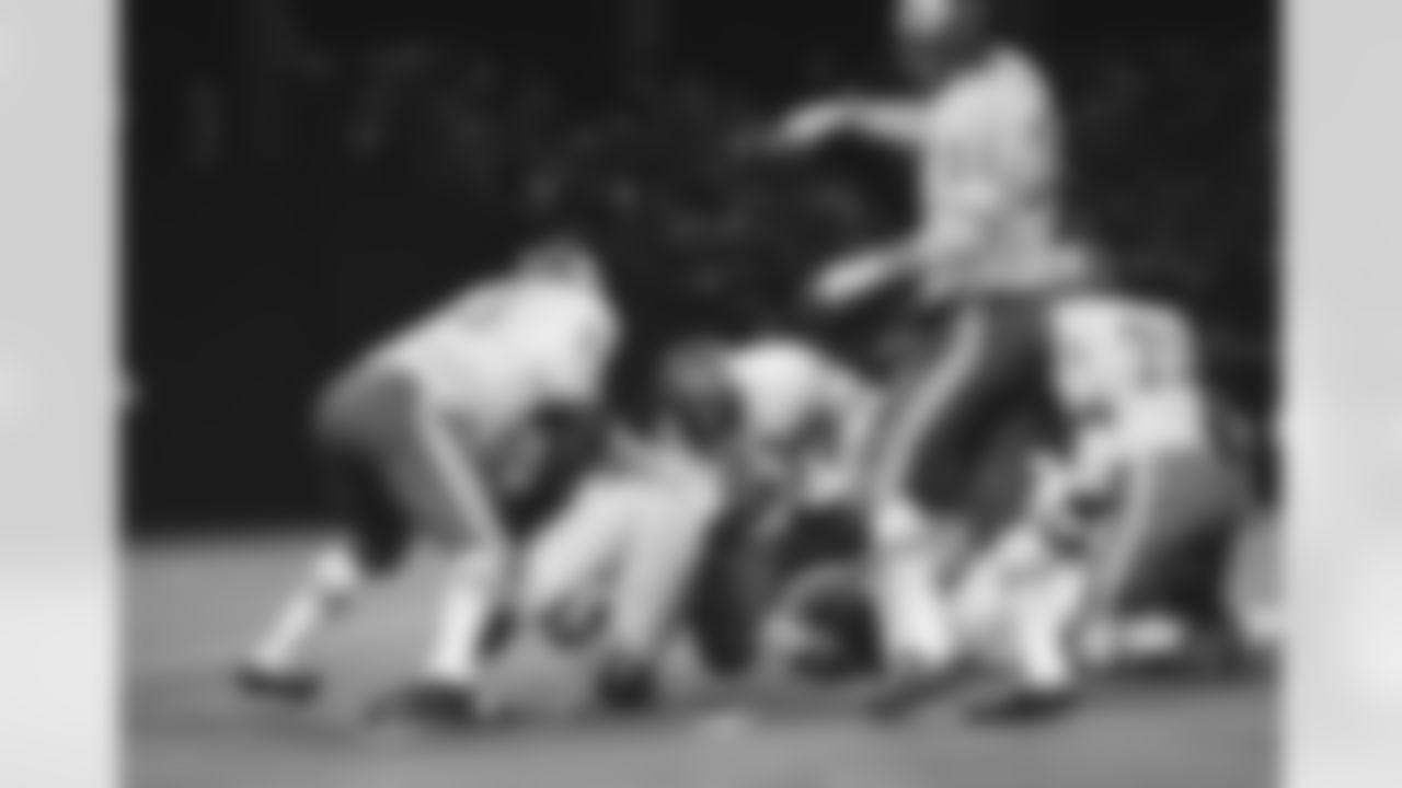 Kansas City Chiefs Curley Culp (61) comes up with a St. Louis Cardinals fumble during the second quarter of game at St. Louis, on Saturday, night, Sept. 12, 1970. Cardinals Cid Edwards dropped the ball after a no gain against the Chiefs and Culp came up with the ball. (AP Photo/JCI)