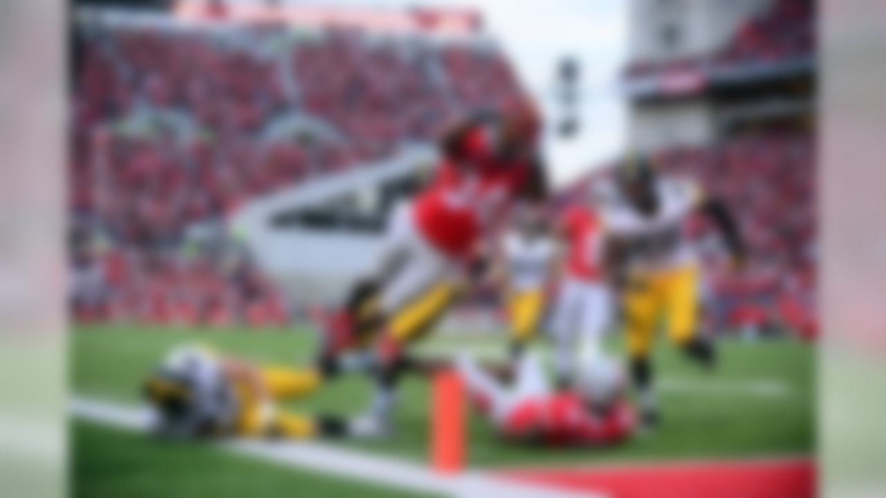 Oct 19, 2013; Columbus, OH, USA; Ohio State Buckeyes running back Carlos Hyde (34) dives into the end zone for a touchdown during the fourth quarter against the Iowa Hawkeyes at Ohio Stadium. (Andrew Weber-USA TODAY Sports)