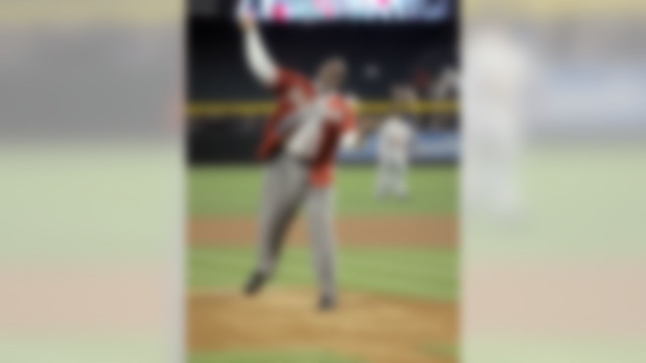 Arizona Cardinals first-round draft pick, offensive lineman Levi Brown throws the first pitch prior to the San Francisco Giants-Arizona Diamondbacks baseball game Sunday, April 29, 2007, in Phoenix. (AP Photo/Paul Connors)