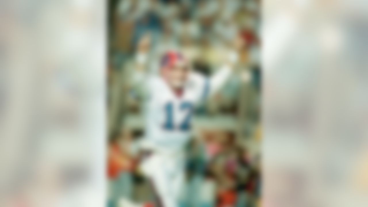 Buffalo Bills quarterback Jim Kelly celebrates the Bills first touchdown against New York Giants in Super Bowl XXV in Tampa Sunday, Jan. 27, 1991. (AP Photo/Lennox McLendon)