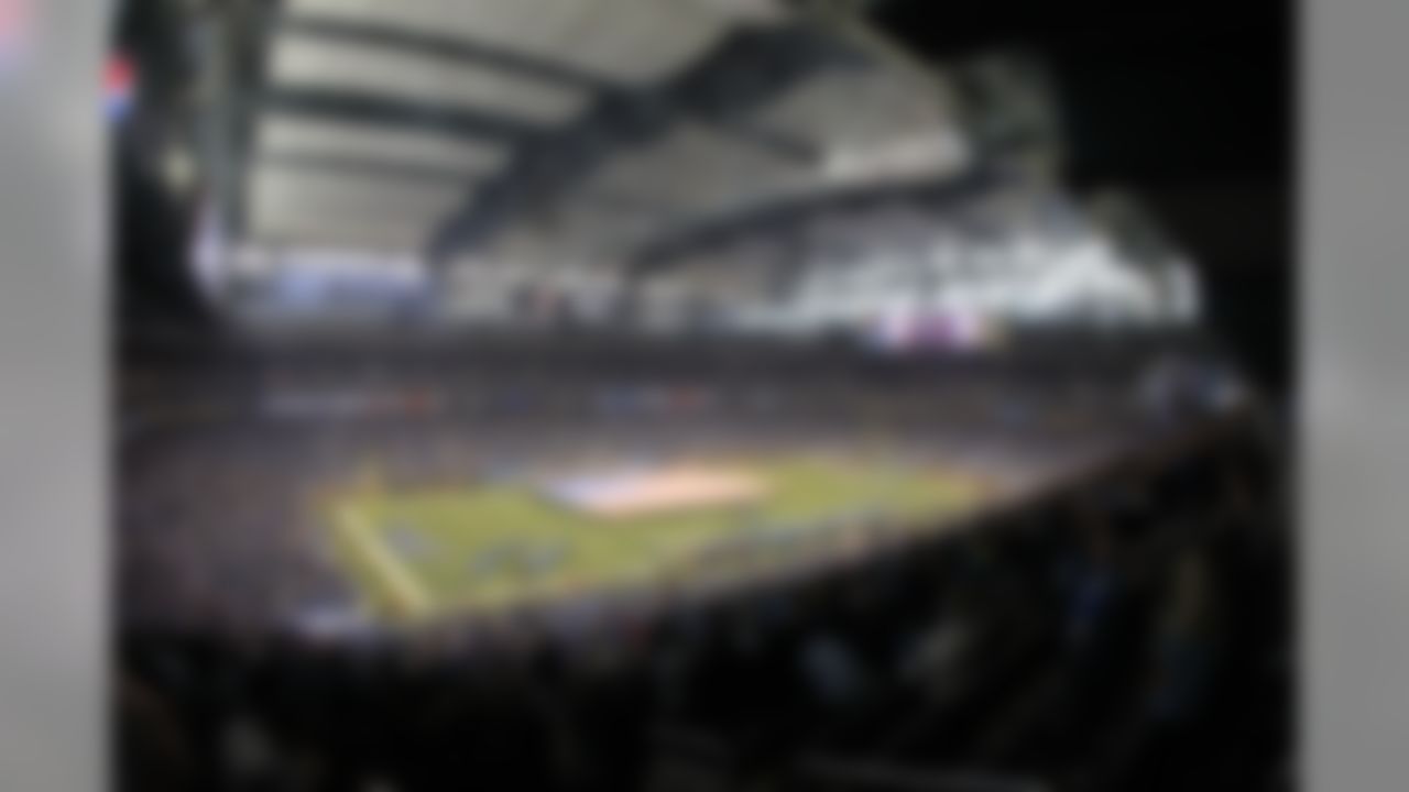 An American flag is unfurled during the national anthem before the start of an NFL football game between the Detroit Lions and the Houston Texans at Ford Field in Detroit, Thursday, Nov. 22, 2012. (AP Photo/Carlos Osorio)