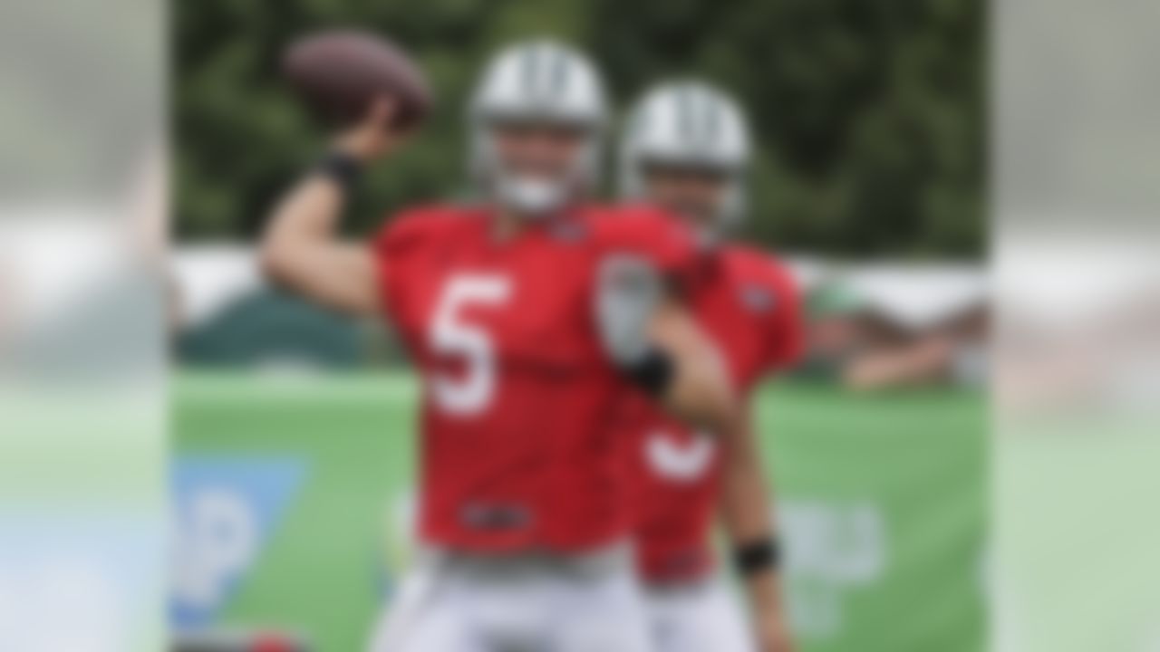 New York Jets quarterback Christian Hackenberg, left, throws while Bryce Petty looks on during NFL football training camp in Florham Park, N.J., Tuesday, Aug. 8, 2017. (AP Photo/Seth Wenig)