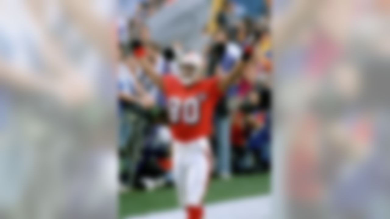 FILE - In this Jan. 29, 1995, file photo, San Francisco 49ers wide receiver Jerry Rice tries to get the crowd cheering prior to the start of Super Bowl XXIX against the San Diego Chargers at Joe Robbie Stadium in Miami. The 49ers are looking to win their sixth title when they take on the Baltimore Ravens in NFL football's Super Bowl XLVII on Sunday in New Orleans. (AP Photo/Andrew Innerarity, File)