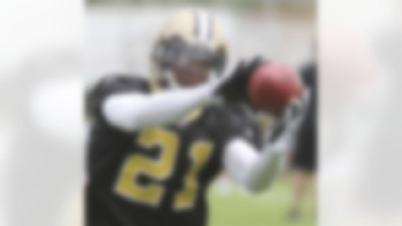 New Orleans Saints safety Chip Vaughn (21) catches a ball during pracitce at the club's NFL football training facility in Metairie, Friday, June 4, 2010. (AP Photo/Bill Haber)