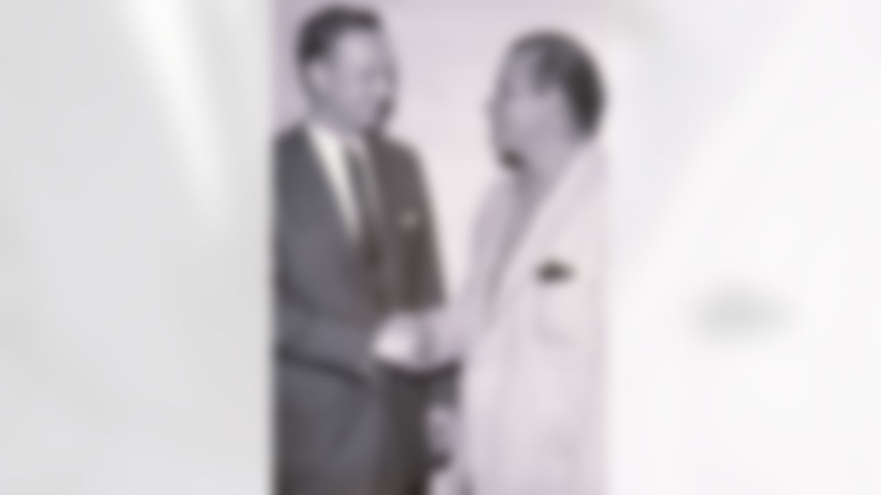 LOS ANGELES - DECEMBER 01: Los Angeles Rams public relations director Pete Rozelle meets with head coach Sid Gillman during the 1957 season in Los Angeles, California. (Photo by NFL Photos/Getty Images)
