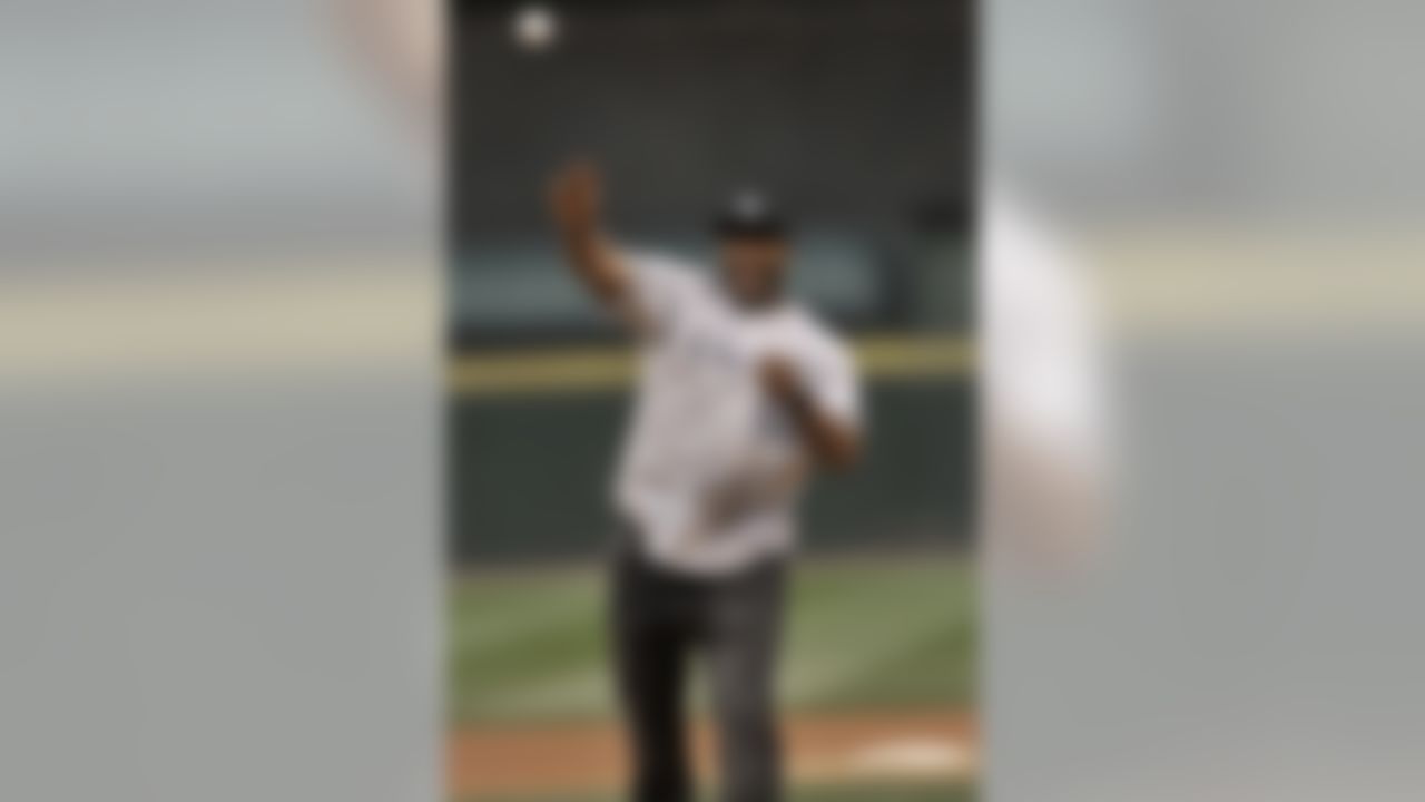 Chicago Bears' Nate Collins throws out the ceremonial first pitch before a baseball game between the Chicago White Sox and the Detroit Tigers in Chicago, Tuesday, April 29, 2014, in Chicago. (Paul Beaty/Associated Press)
