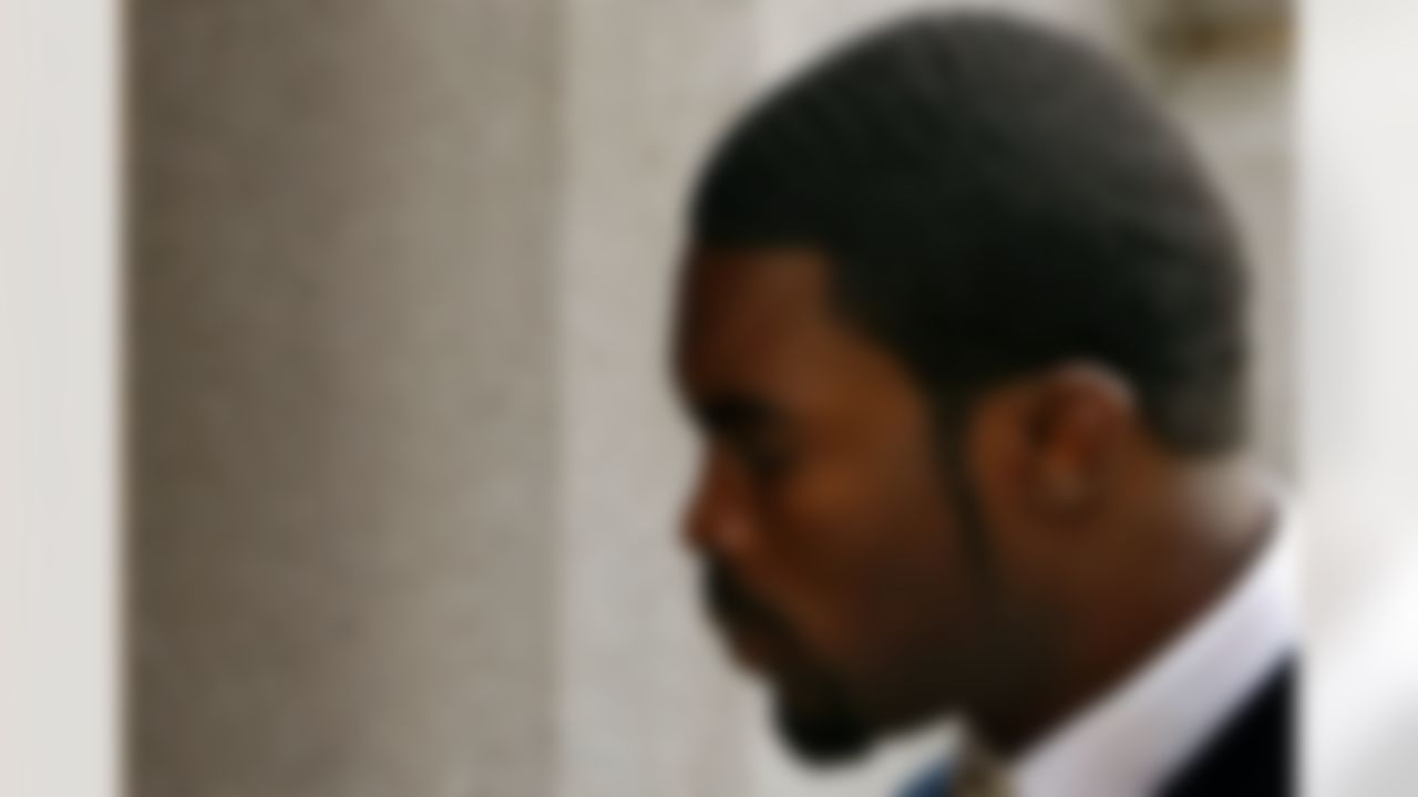RICHMOND, VA - AUGUST 27: Atlanta Falcons quarterback Michael Vick arrives at federal court August 27, 2007 in Richmond, Virginia. The football star was expected to plead guilty to a federal dogfighting conspiracy charge. The NFL has suspended Vick indefinitely. (Photo by Win McNamee/Getty Images)