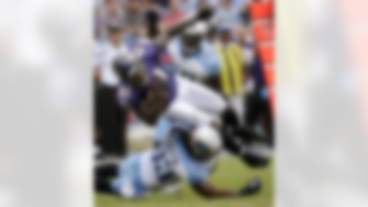 Baltimore Ravens wide receiver Anquan Boldin (81) is tripped up by Tennessee Titans safety Michael Griffin (33) in the second quarter of an NFL football game Sunday, Sept. 18, 2011, in Nashville, Tenn. (AP Photo/John Russell)
