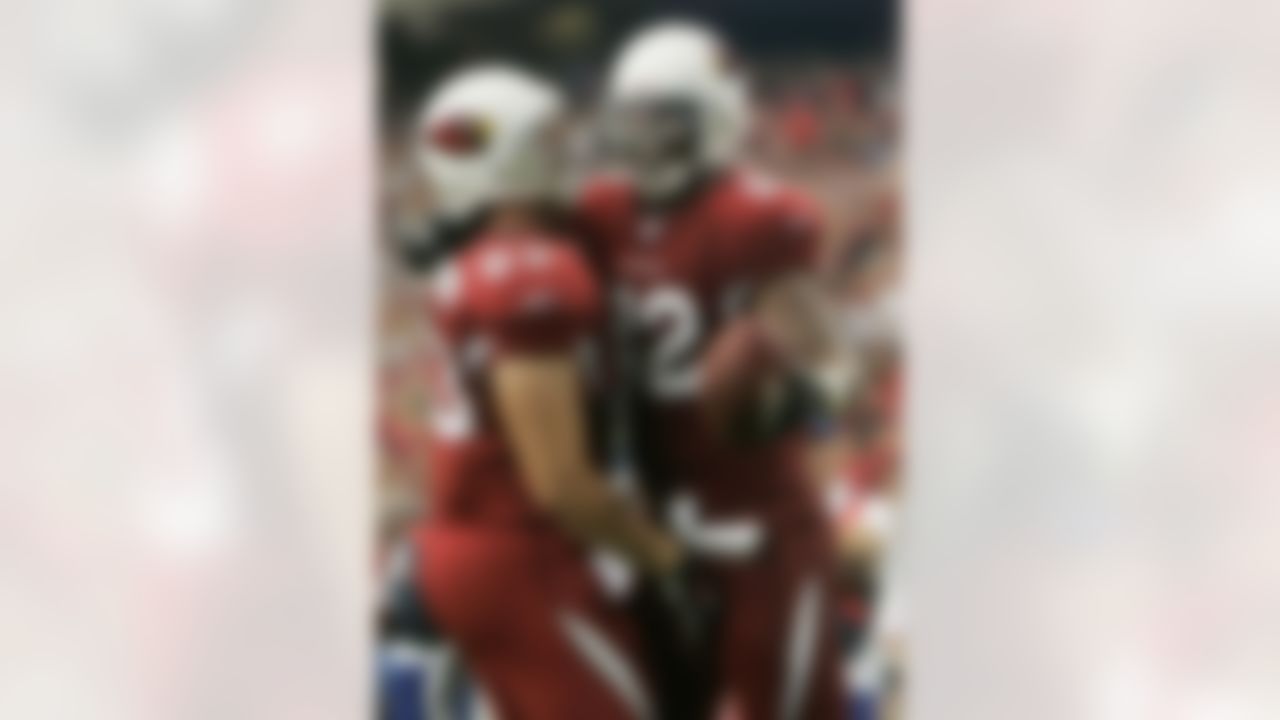 GLENDALE, AZ - NOVEMBER 11: Troy Bienemann #83 and Leonard Pope #82 of the Arizona Cardinals celebrate Pope's first touchdown of the game in the second quarter against the Detroit Lions at the University of Phoenix Stadium November 11, 2007 in Glendale, Arizona. The Cardinals defeated the Lions 31-21. (Photo by Jeff Gross/Getty Images)