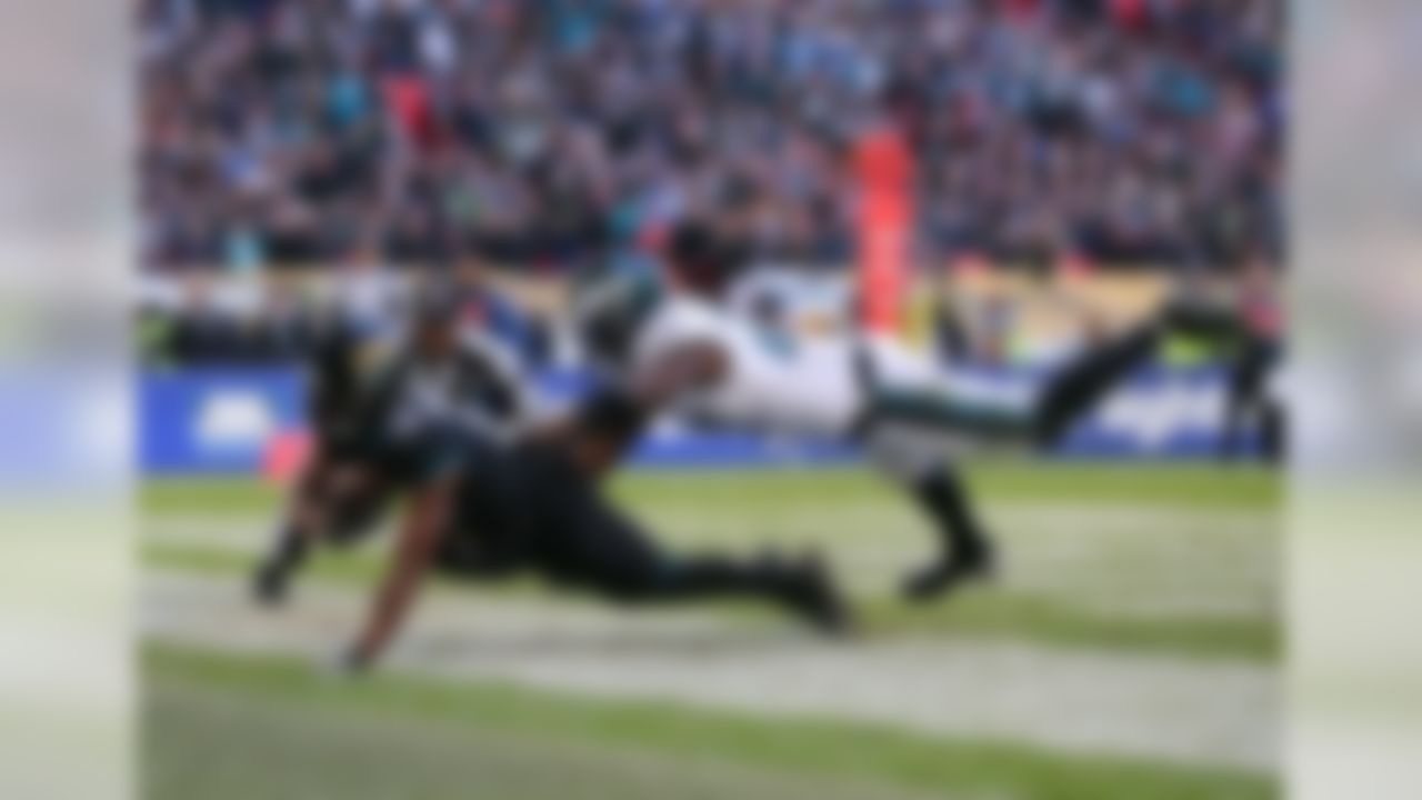 Jacksonville Jaguars wide receiver Dede Westbrook (12) scores a touchdown in front of Philadelphia Eagles defensive back Malcolm Jenkins (27) during an NFL football game on Sunday, October 28th, 2018 at Wembley Stadium in London.