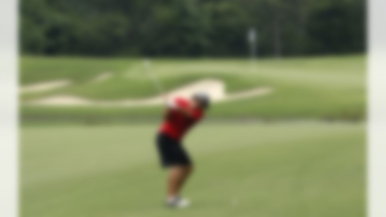 Dallas Cowboys quarterback Tony Romo hits his approach shot on the 10th hole during sectional qualifying for the 2010 U.S. Open golf tournament Monday, June 7, 2010, at the Club at Carlton Woods in The Woodlands, Texas. The U.S. Open will be played June 14-20 at Pebble Beach Golf Links in Pebble Beach, Calif. (AP Photo/David J. Phillip)