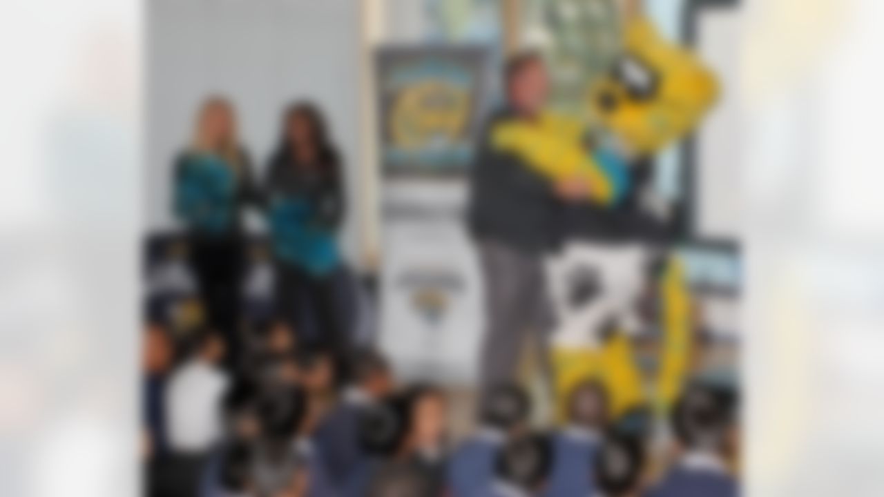 The Jacksonville Jaguars cheerleaders visit Shaftesbury Primary School in London as part of the NFL International Series. Jaxson De Ville dances with a teacher. The Dallas Cowboys play the Jacksonville Jaguars at Wembley Stadium on Sunday, Nov. 9, 2014. (Nicky Hayes/NFL)