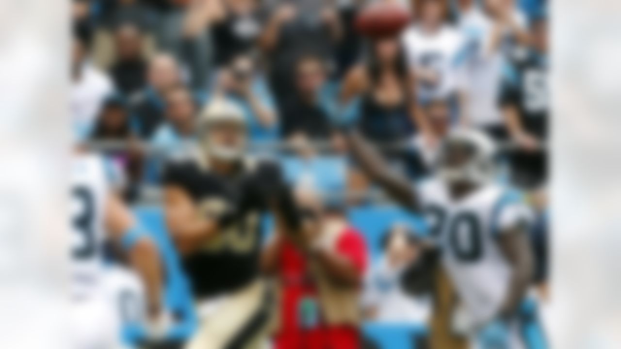 New Orleans Saints' Jimmy Graham (80) looks to make the catch as Carolina Panthers' Chris Gamble (20) gets a hand up to deflect during the second half in Charlotte, N.C., Sunday Sept. 16, 2012. The Panthers won 35-27. (AP Photo/Bob Leverone)