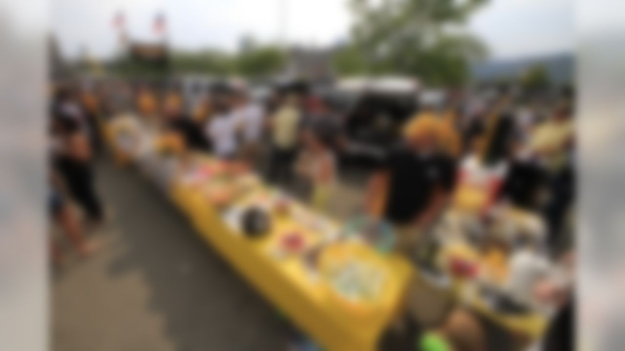 Pittsburgh Steelers fans tailgate outside Heinz Field before an NFL football game between the Pittsburgh Steelers and Tennessee Titans in Pittsburgh, Sunday, Sept. 8, 2013. (AP Photo/Gene J. Puskar)