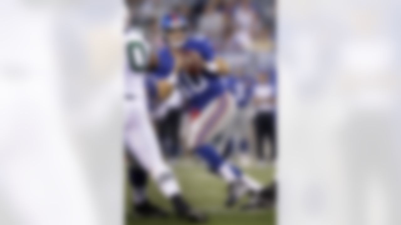 New York Giants quarterback Eli Manning looks to pass during the first quarter of an NFL preseason football game against the New York Jets, Monday, Aug. 29, 2011, in East Rutherford, N.J. (AP Photo/Julio Cortez)