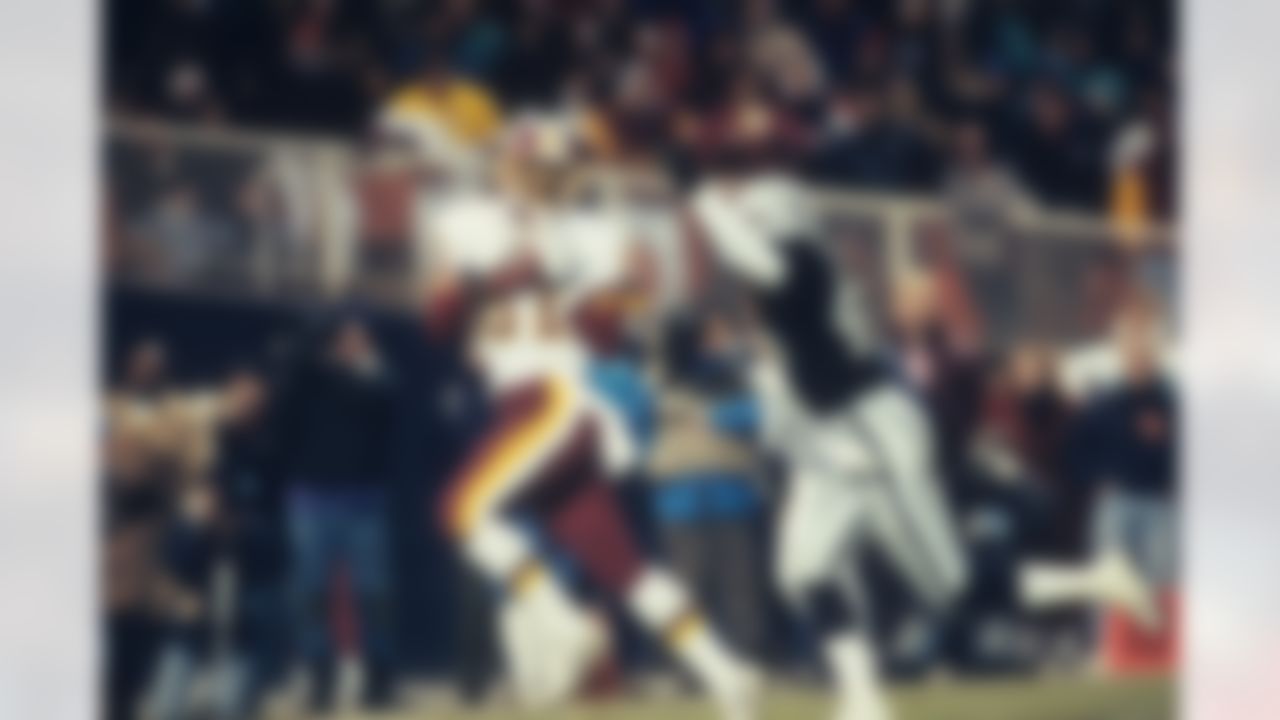 WASHINGTON, D.C. - DECEMBER 26: Wide receiver Art Monk #81 of the Washington Redskins catches a 43-yard pass behind cornerback Torin Dorn #46 of the Los Angeles Raiders at RFK Stadium on December 26, 1992 in Washington, D.C. The Raiders defeated the Redskins 21-20. (Photo by Joseph Patronite/NFL Photos)