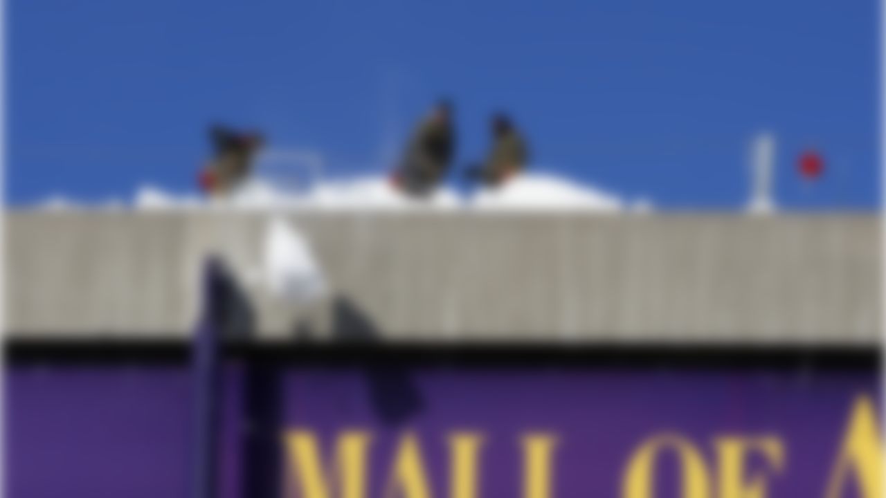 Workers shovel snow off the collapsed roof of Metrodome in Minneapolis Sunday, Dec. 12, 2010. The inflatable roof of the Metrodome collapsed Sunday after a snowstorm in Minneapolis. No one was hurt, but the roof failure sent the NFL scrambling to find a new venue for the Vikings' game against the New York Giants. (AP Photo/Ann Heisenfelt)