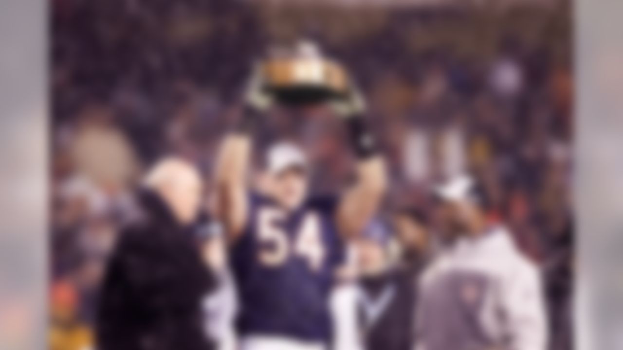 Linebacker Brian Urlacher #54 of the Chicago Bears holds the George Halas NFC Championship Trophy after the game against the New Orleans Saints during the NFC Championship Game January 21, 2007 at Soldier Field in Chicago, Illinois. The Bears defeated the Saints 39-14. (AP Photo/Scott Boehm)