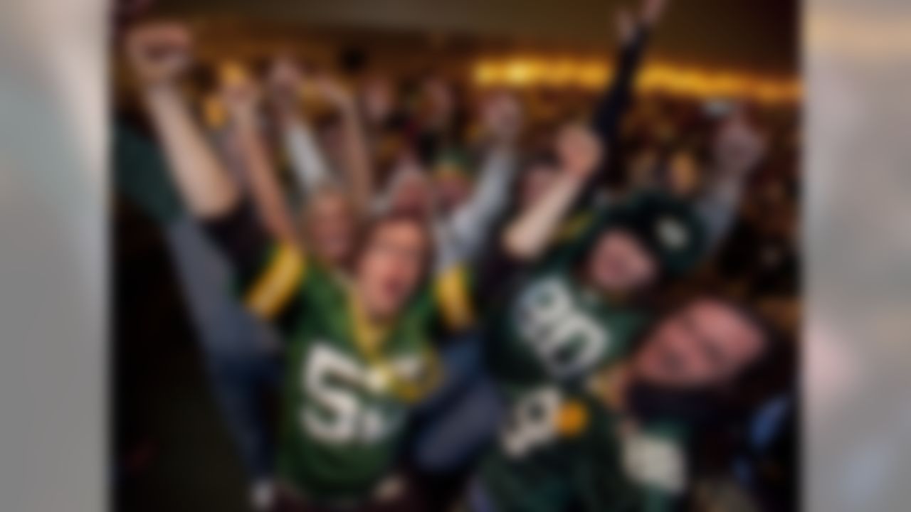 Green Bay Packers fans celebrate, Sunday, Feb. 6, 2011, at the Stadium View Bar near Lambeau Field in Green Bay, Wis., after the Packers won the Super Bowl XLV. The Packers defeated the Pittsburgh Steelers 31-25 for the NFL's football championship title. (AP Photo/Mike Roemer)
