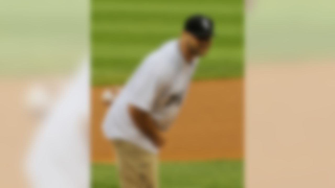 Chicago Bears' Kyle Long throws out the first pitch before a baseball game between the Chicago White Sox and the Cleveland Indians in Chicago on Wednesday, May 28, 2014. (AP Photo/ Matt Marton)