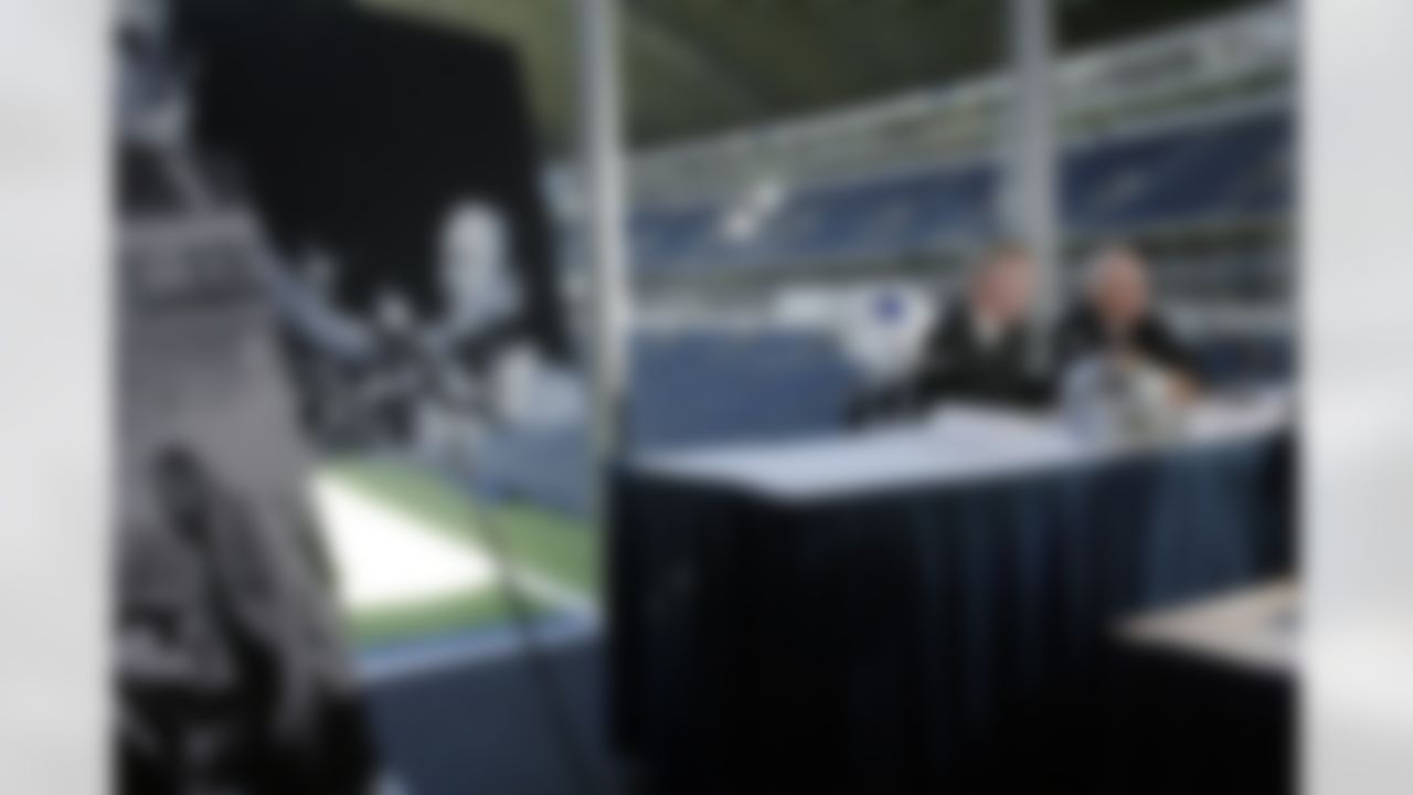 Dallas Cowboys owner Jerry Jones, left, introduces "Tex" Earnest Schramm Jr., former president and general manager of the Dallas Cowboys, at a news conference in Irving, Texas, Wednesday, April 16, 2003. Jones announced at the news conference that Schramm will become the 12th man inducted into the Dallas Cowboys Ring of Honor at Texas Stadium. (AP Photo/Donna McWilliam)