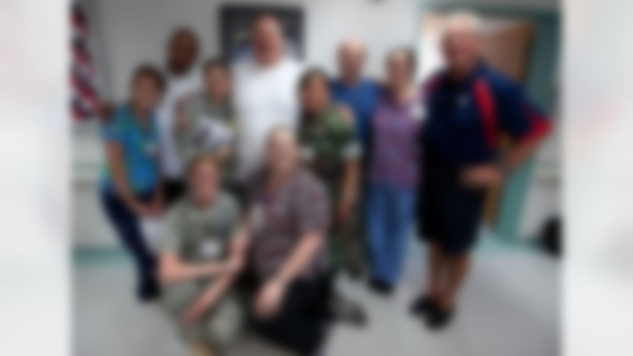 Marvin Lewis, Cincinnati Bengals head coach (back row L), Andy Reid, Philadelphia Eagles head coach (back row 2nd l) , Brad Childress, Minnesota Vikings head coach (3rd r) and John Fox, Carolina Panthers head coach (r) pose for a photo with medical staff during a tour stop at Landsthul Regional Medical Center in Germany on June 29, 2010. For the second consecutive year, the National Football League (NFL) deployed four of its most sought-after coaches to the Persian Gulf to visit troops as part of a week-long USO/Armed Forces Entertainment tour. (Fred Greaves/USO)