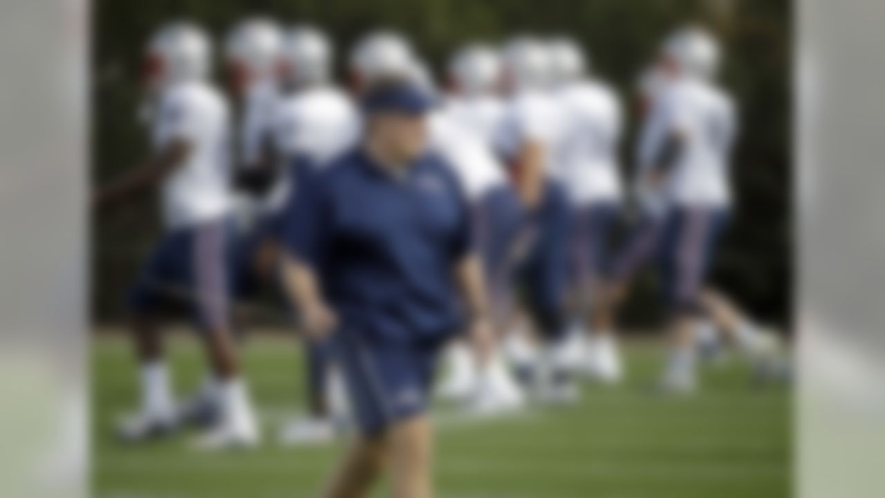 New England Patriots head coach Bill Belichick watches players warm up during practice Wednesday, Jan. 28, 2015, in Tempe, Ariz. The Patriots play the Seattle Seahawks in NFL football Super Bowl XLIX Sunday, Feb. 1, in Glendale, Ariz. (AP Photo/Mark Humphrey)