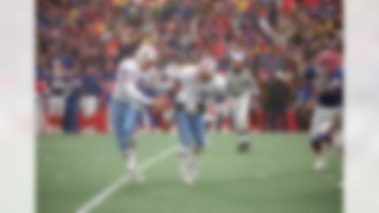 Houston Oilers kicker Al Del Greco (3) and holder Greg Montgomery (9) juggle the ball after an aborted field goal attempt during the fourth quarter of their game against the Buffalo Bills, Jan. 3, 1993 at Rich Stadium in Orchard Park, N.Y. The field goal would have been the margin of victory, avoiding the overtime period. The bills won the game in overtime 41-38. (AP Photo/Bill Sikes)