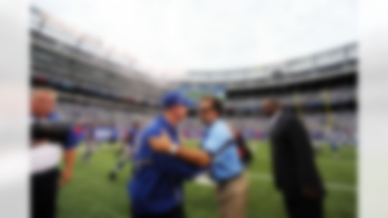 New York Giants head coach Tom Coughlin shakes hands with Tennessee Titans head coach Jeff Fisher after a week 3 NFL football game at the New Meadowlands Stadium in East Rutherford, New Jersey on Sunday September 26, 2010. (AP Photo/Evan Pinkus)